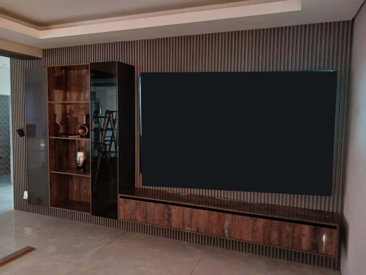 Modern living room entertainment wall with slatted wood paneling and custom cabinetry