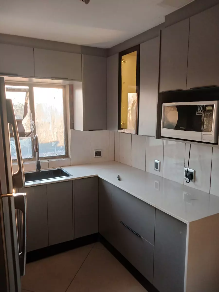 Modern kitchen interior with cabinets, countertops and sink